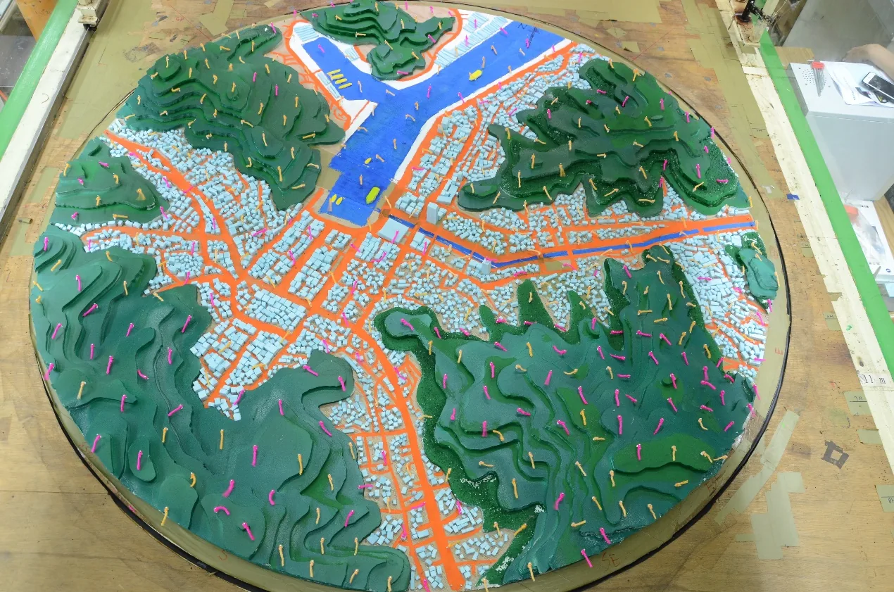 Terrain model on the wind tunnel turntable with wind tufts